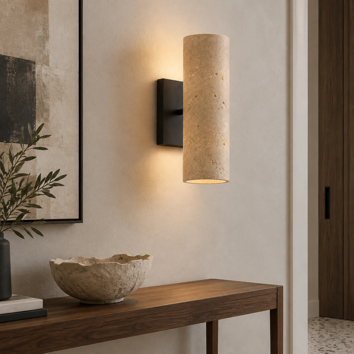 Bronze Cian wall light with a travertine shade in a modern entrance
