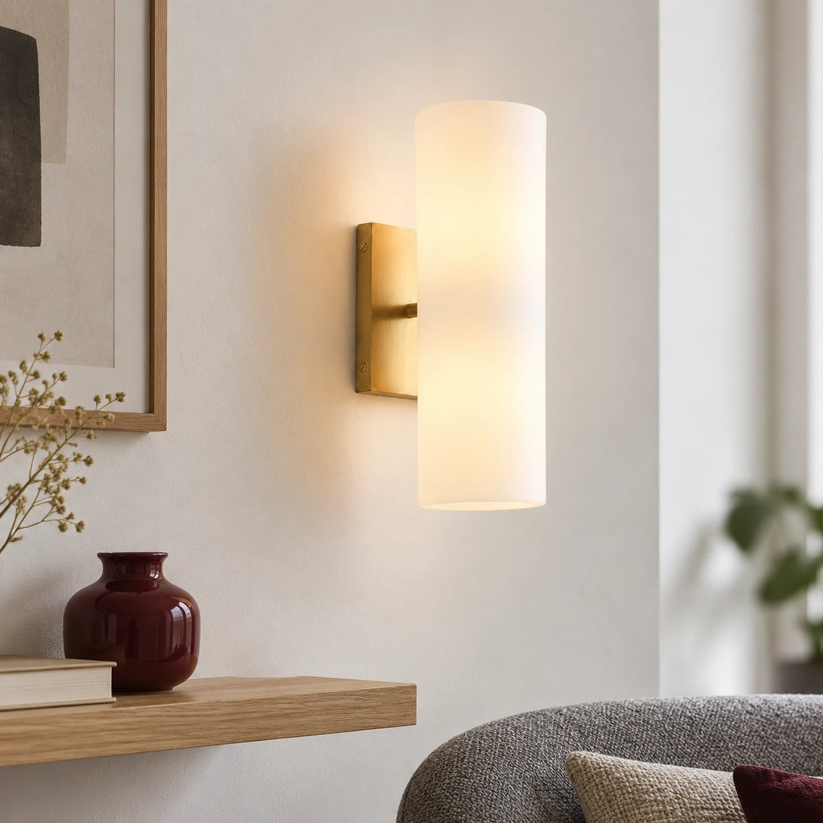 Brass Cian wall light with a smooth milk glass shade